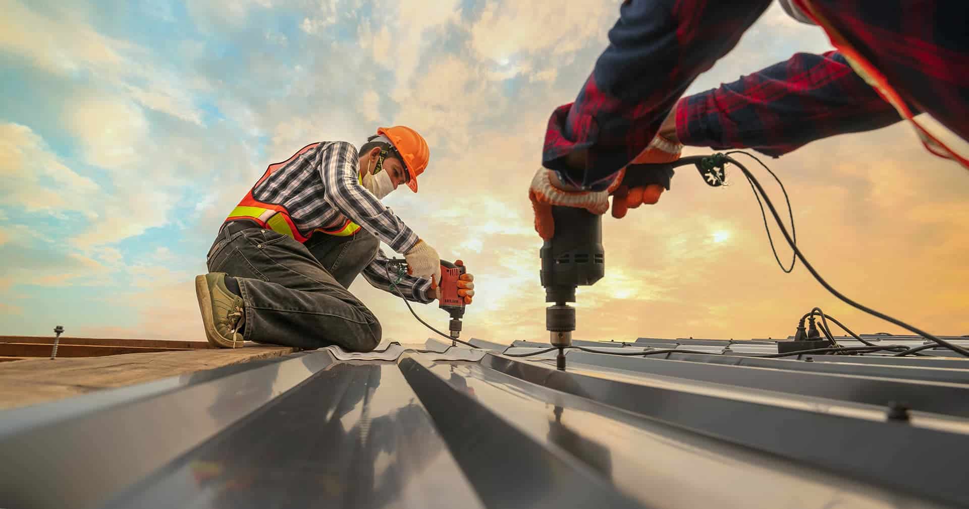 Commercial metal roofing installation on a large roof
