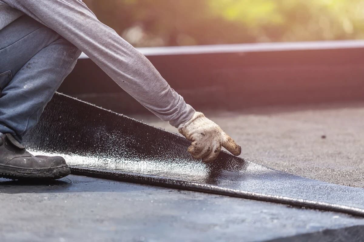 Flat roof repair area on a low-slope roof