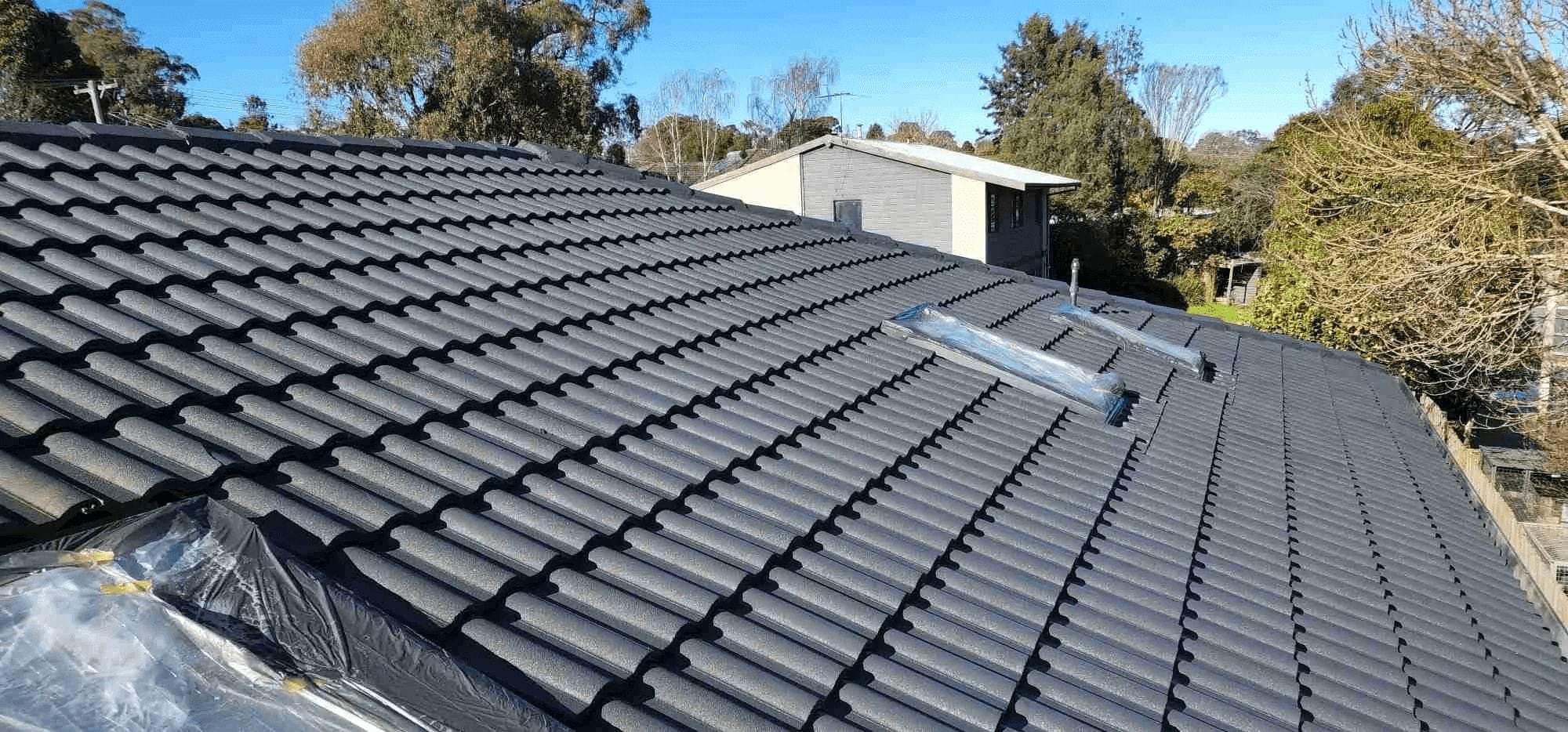 Freshly painted tiled roof on a residential property