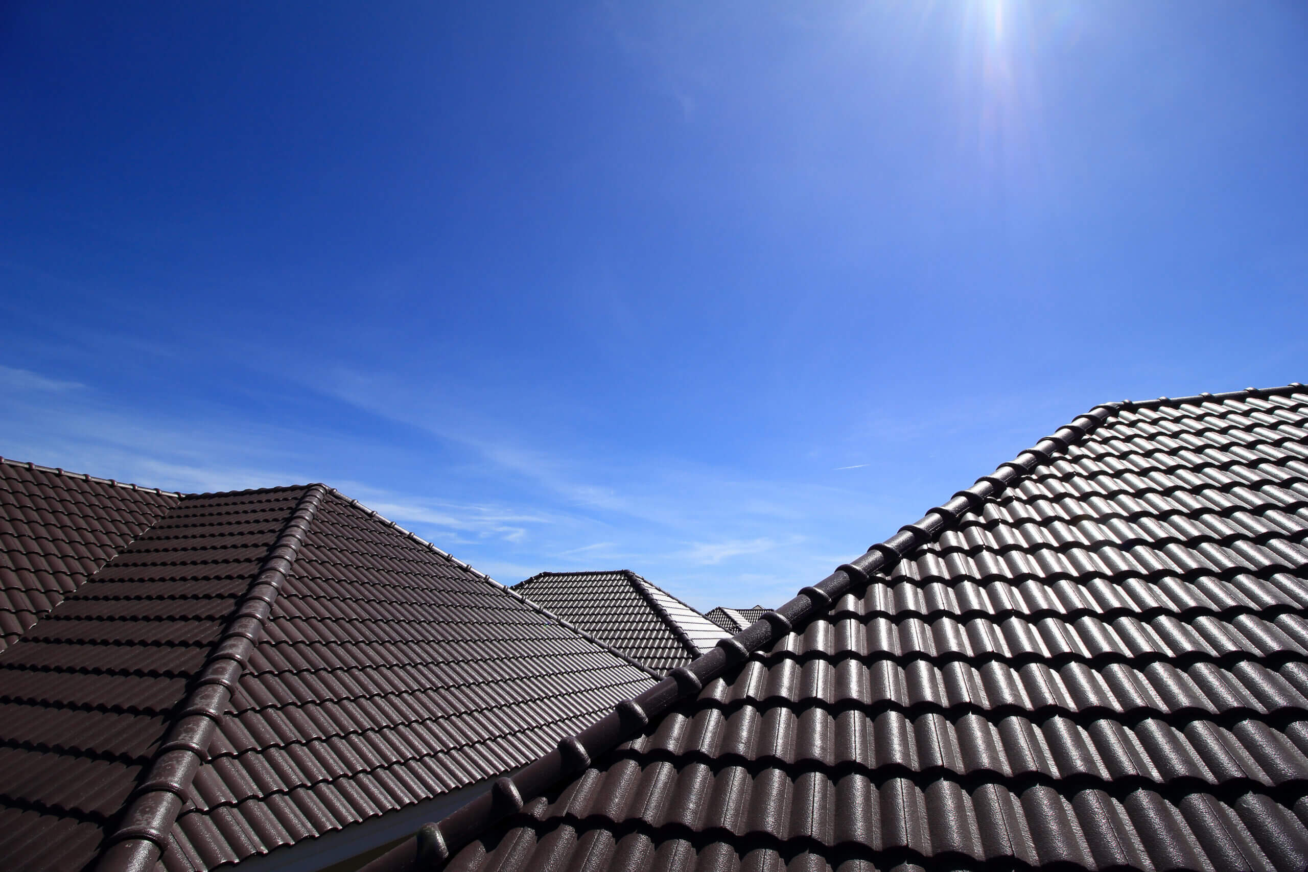 Dark tiled roof prepared for restoration work